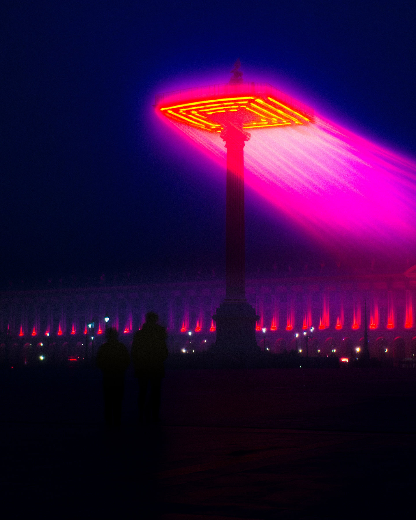 A luminous geometric tower projecting pink light through blue haze.